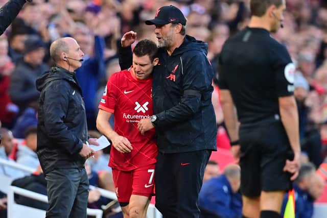 Jurgen Klopp embraces James Milner after he is substituted in Liverpool’s draw against Man City. Picture: PAUL ELLIS/AFP via Getty Images