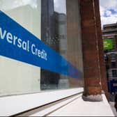 A sign for Universal Credit in a Job Centre window. (Photo by Jack Taylor/Getty Images)