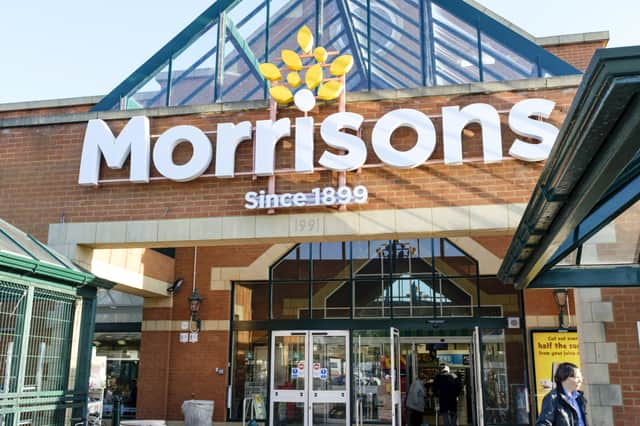 Shoppers outside the front of a Morrisons store in Hatch End, London.