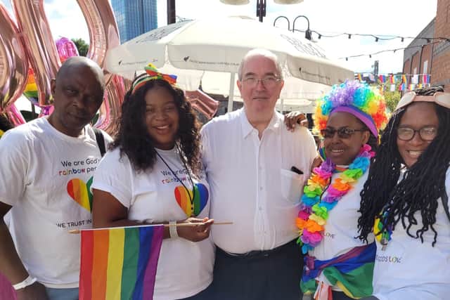 Philip Jones (centre) helped LGBTQ+ asylum seekers in Manchester