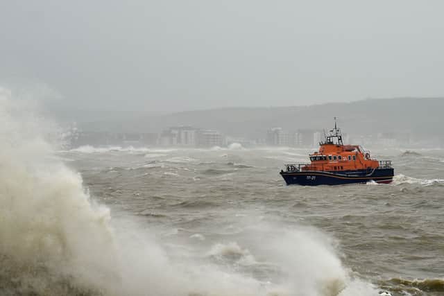 An RNLI lifeboat at sea in a storm. Photo: Glyn Kirk/AFP via Getty Images)