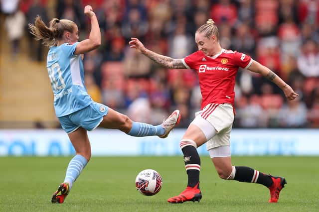 Georgia Stanway was shown a red card for this foul on Leah Galton. (Photo by Naomi Baker/Getty Images)