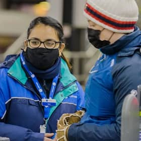A member of Northern Rail staff helping a customer (Pic from Northern) 
