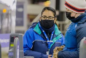 A member of Northern Rail staff helping a customer (Pic from Northern) 