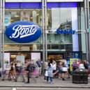 Members of the public walk past a branch of Boots the chemist (Pic from Getty)