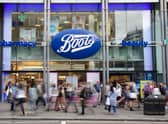 Members of the public walk past a branch of Boots the chemist (Pic from Getty)