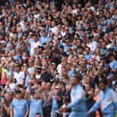 Manchester City fans greet their team ahead of the English Premier League football match between Manchester City and Southampton at the Etihad Stadium in Manchester, north west England, on September 18, 2021. (Photo by OLI SCARFF/AFP via Getty Images)