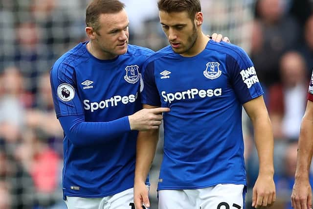 Wayne Rooney speaks to Nikola Vlasic. Picture: Clive Brunskill/Getty Images