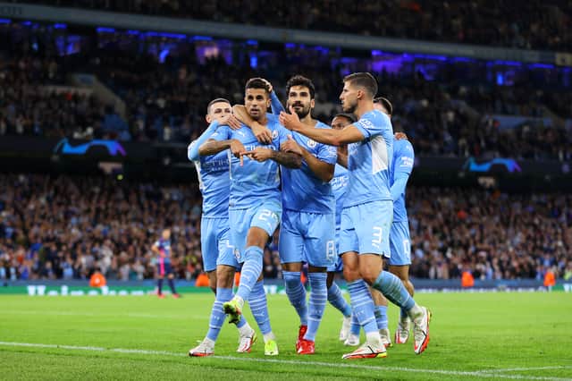 Manchester City celebrate scoring in Champions League. Credit: Getty.