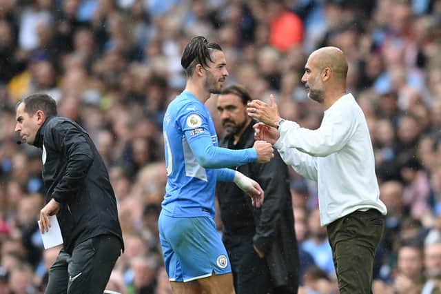 Jack Grealish and Pep Guardiola. Credit: Getty.