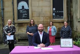 Salford mayor Paul Dennett signs an agreement with Buile Hill Mansion Association (L-R: Jennifer-Anne Smith, Petra Vanila Vartovnikova, Markéta Crehan Lážová and Wendy Francis). Credit: Salford City Council. Caption: Joseph Timan.