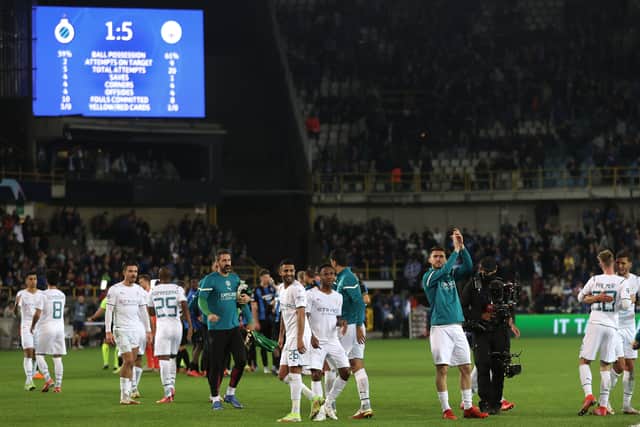 Players thank the supporters after the Champions League match. Photo by Julian Finney/Getty Images