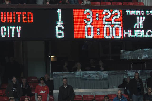 The scoreboard shows the final score in the English Premier League football match between Manchester United and Manchester City at Old Trafford  Credit: AFP PHOTO/Andrew Yates via Getty