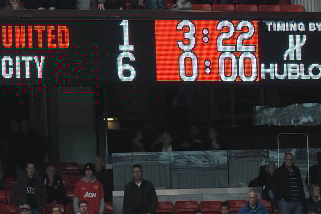 The scoreboard shows the final score in the English Premier League football match between Manchester United and Manchester City at Old Trafford Credit: AFP PHOTO/Andrew Yates via Getty