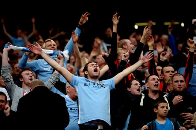 Manchester City fans celebrate   Credit: Laurence Griffiths/Getty Images