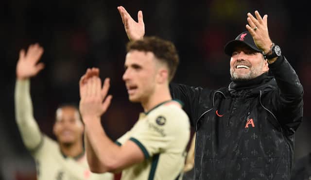 <p>Jurgen Klopp and Diogo Jota celebrate victory at Old Trafford. Photo: OLI SCARFF/AFP via Getty Images</p>
