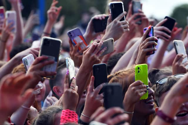 Unwanted and duplicate photos on our phones are contributing hundreds of thousand of tons of CO2 every year. (Pic from Getty Images)