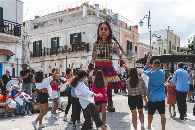 The giant puppet makes its way through Bari in Italy. Photo: Teatro Pubblico Pugliese