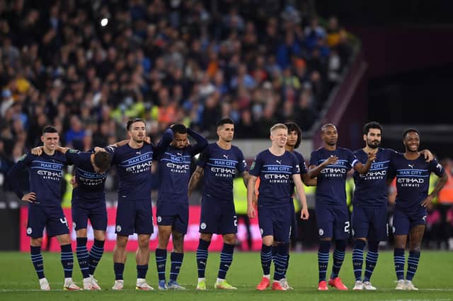 <p>Man City players watch as the winning penalty is scored  Creit: Getty</p>