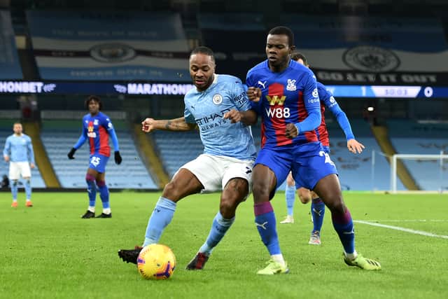 Raheem Sterling is closed down by Tyrick Mitchell. Credit: Getty.