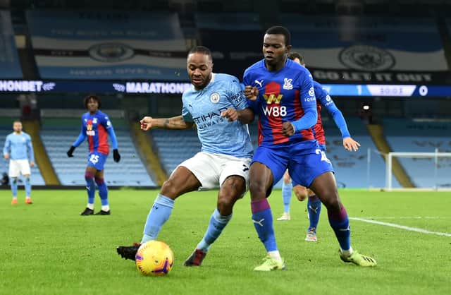 <p>Raheem Sterling is closed down by Tyrick Mitchell. Credit: Getty.</p>