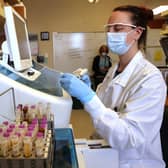 Medical laboratory scientist, Aniela Sobel, tests serology samples from the Novavax phase 3 Covid-19 clinical vaccine trial (Photo by Karen Ducey/Getty Images)