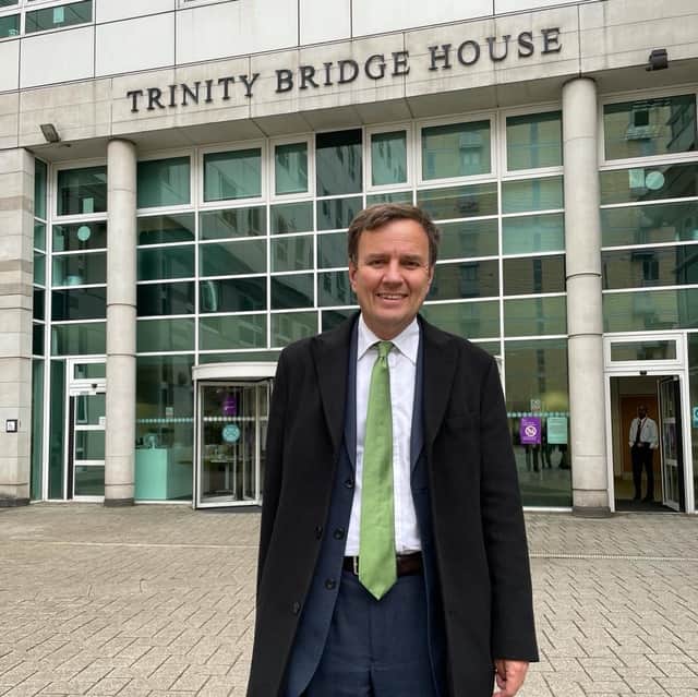 <p>Greg Hands outside Trinity Bridge House in Salford Credit: LDRS</p>