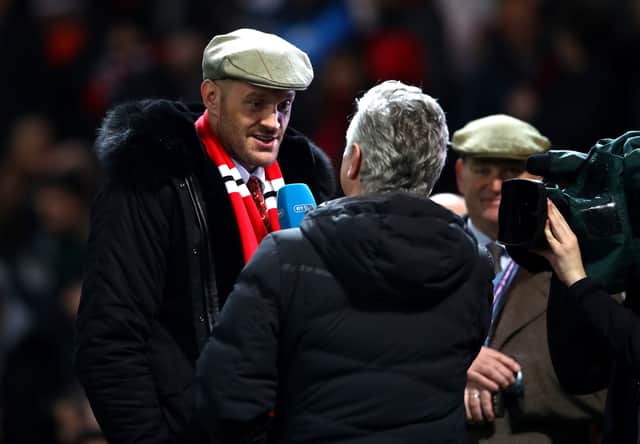 Tyson Fury, pictured here at Old Trafford, is a Manchester United supporter. Credit: Getty.