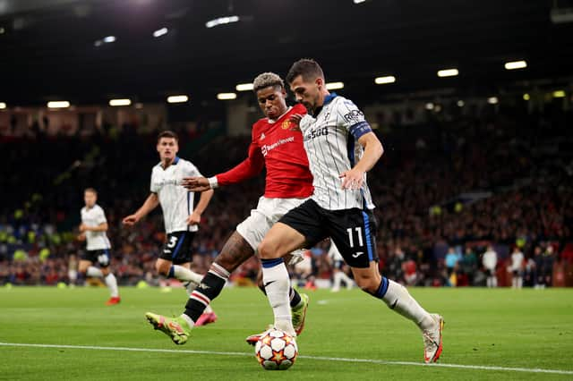 Marcus Rashford closes down Remo Freuler. Credit: Getty.