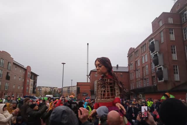 A huge crowd braves the rain to see Little Amal in Wigan