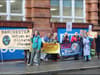 Pyjama protest outside Manchester authority’s offices against pension fund’s £1bn fossil fuel investments