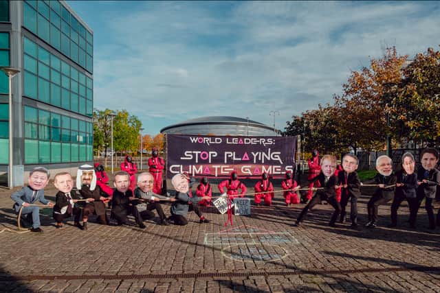 Climate activists stage a protest based on Squid Game at COP26. Photo: Joao Daniel Pereira