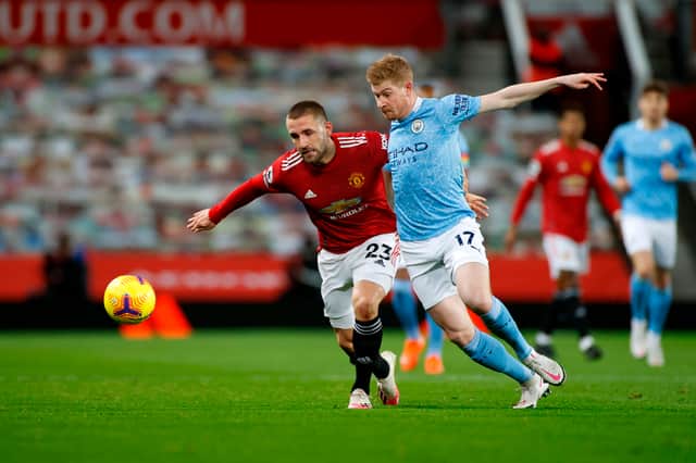 Luke Shaw and Kevin De Bruyne compete for the ball in the Manchester derby. Credit: Getty.