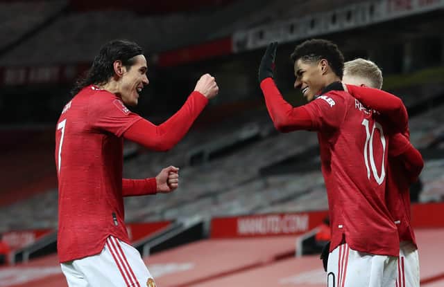 <p>Edinson Cavani celebrates a goal with Marcus Rashford. Credit: Getty.</p>