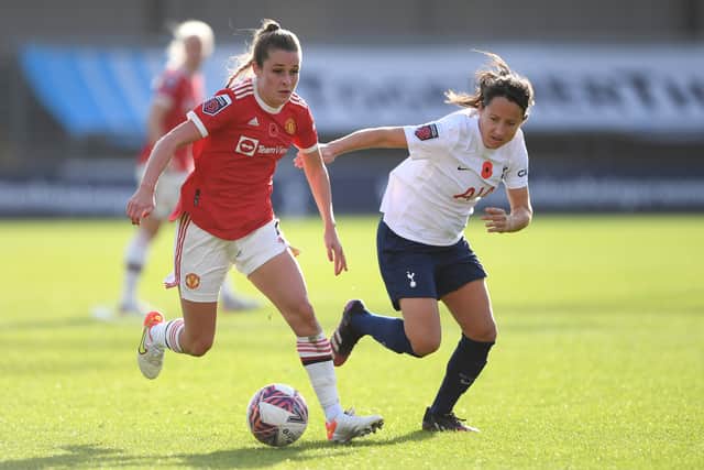 Ella Toone of Manchester United battles for possession with Maeva Clemaron of Tottenham Hotspur Credit: Getty Images