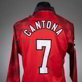  Eric Cantona red and white Manchester United no.7 home shirt Credit: Graham Budd Auctions / SWNS