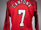 Eric Cantona red and white Manchester United no.7 home shirt Credit: Graham Budd Auctions / SWNS