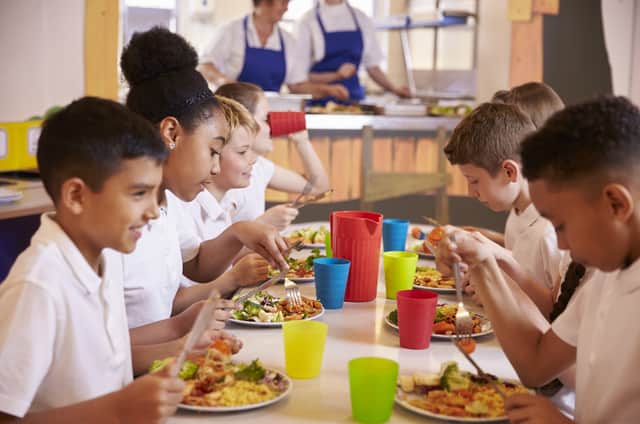 Primary school children enjoying a meal 