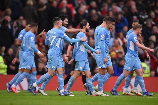 Manchester City players celebrate scoring at Old Trafford. Credit: Getty.