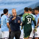 Pep Guardiola coaches his players during game against Liverpool. Credit: Getty.