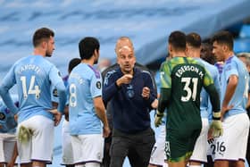 Pep Guardiola coaches his players during game against Liverpool. Credit: Getty.