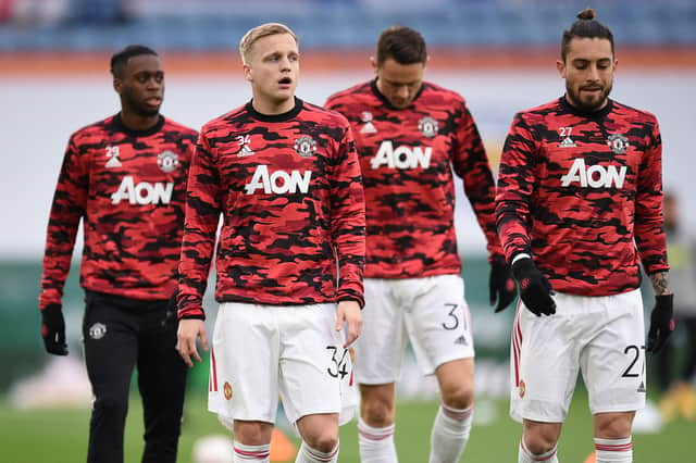 Donny van de Beek and Alex Telles warm up before a game. Credit: Getty.