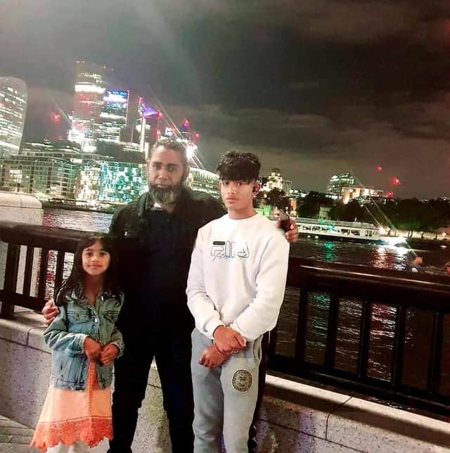 Mohammed Rahman with his two children