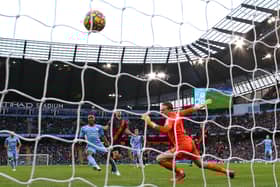 Raheem Sterling of Manchester City scores their side’s first goal past Jordan Pickford of Everton Credit: Getty Images
