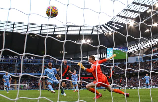 Raheem Sterling of Manchester City scores their side’s first goal past Jordan Pickford of Everton Credit: Getty Images