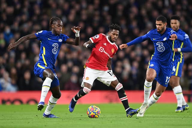 Fred of Manchester United battles for possession with Trevoh Chalobah (L) and Ruben Loftus- (Photo by Shaun Botterill/Getty Images )