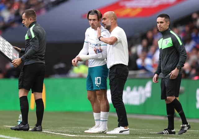 <p>Jack Grealish and Pep Guardiola. Credit: Getty.</p>