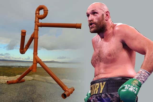 <p>Tyson Fury and the drainpipe sculpture of himself in Morecambe</p>
