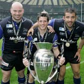 (L to R) The Sale Front Row of Stuart Turner, Andy Titterrell and Lionel Faure pose with the trophy following their team’s victory during the Guinness Premiership Final between Sale Sharks and Leicester Tigers at Twickenham on May 27, 2006 Credit: Getty