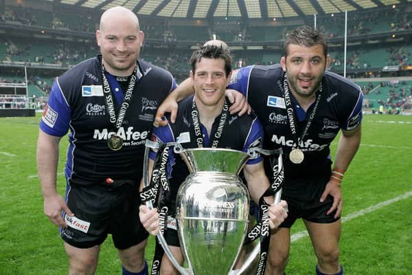 (L to R) The Sale Front Row of Stuart Turner, Andy Titterrell and Lionel Faure pose with the trophy following their team’s victory during the Guinness Premiership Final between Sale Sharks and Leicester Tigers at Twickenham on May 27, 2006 Credit: Getty